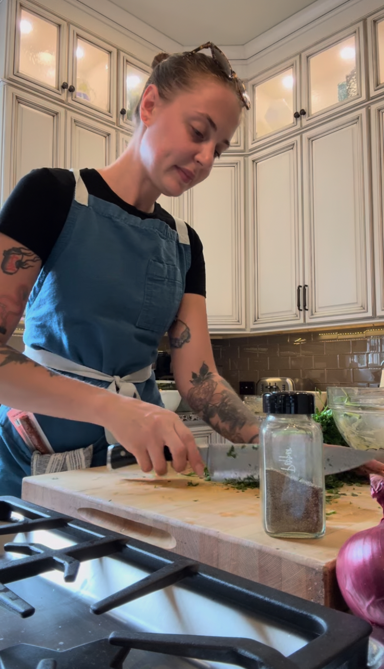 Serra chopping fresh herbs