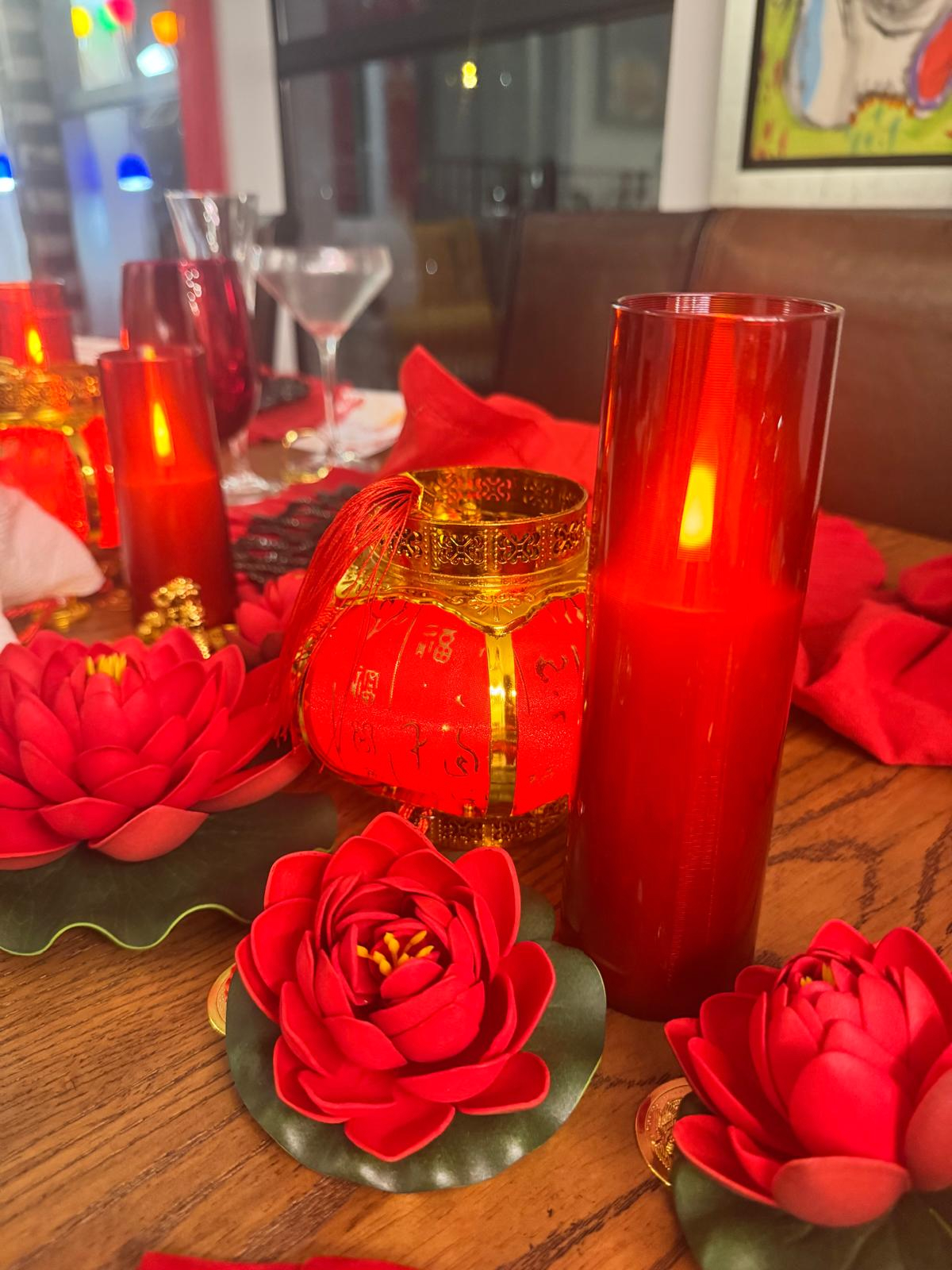 Services Lunar New Year table with red lanterns, candles and lotus flowers